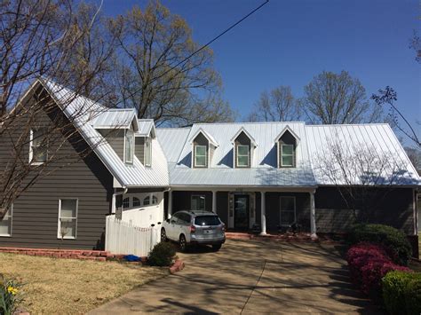 withe house with metal roof|white house with galvalume roof.